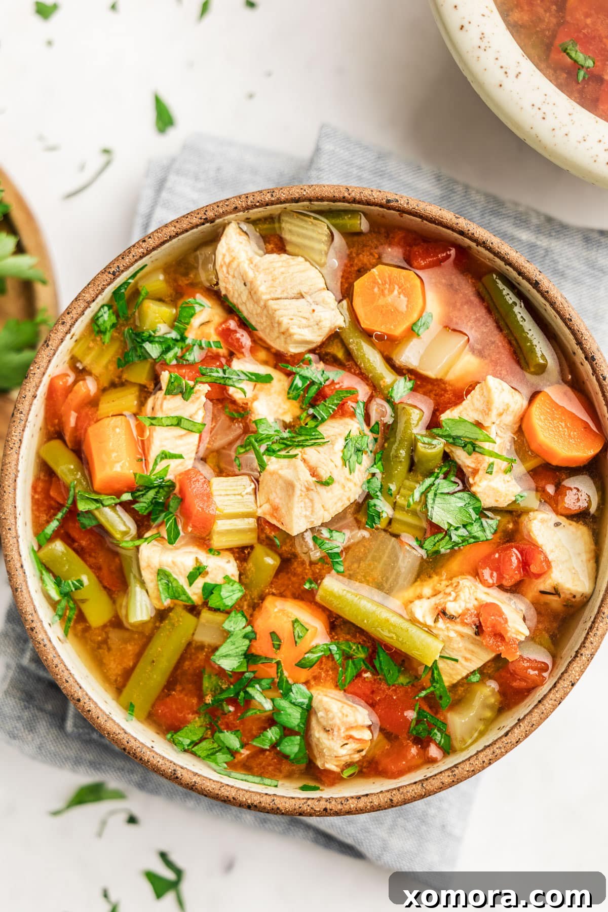 Close-up of fresh vegetables and chicken diced, ready to be added to the Instant Pot for soup.