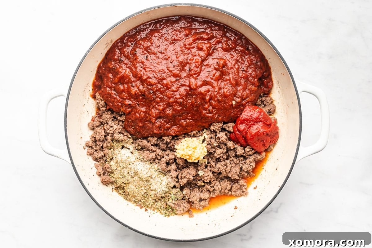 Delicious homemade spaghetti sauce simmering gently on the stove