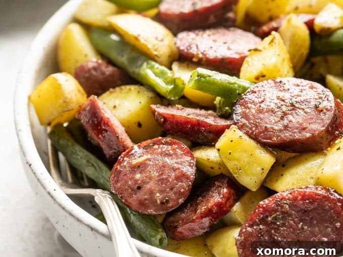 Sheet Pan Sausage and Roasted Vegetables 4 Close-up of roasted sheet pan sausage, potatoes, and green beans, perfectly golden and tender.