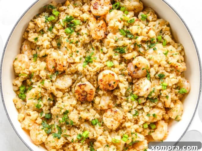 Zesty Cajun Shrimp and Cauliflower Rice Power Bowl 3 Close-up of cooked Cajun Shrimp and Cauliflower Rice with visible seasoning and shrimp texture.