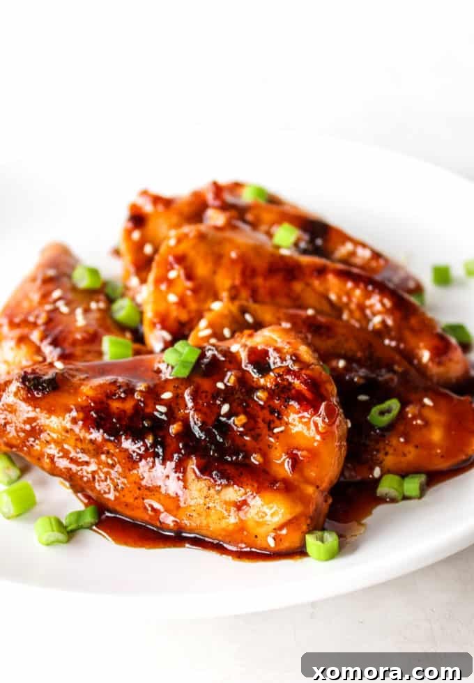15-Minute Sticky Honey Chicken 4 Plated 15-Minute Honey Chicken served with green beans and roasted carrots.