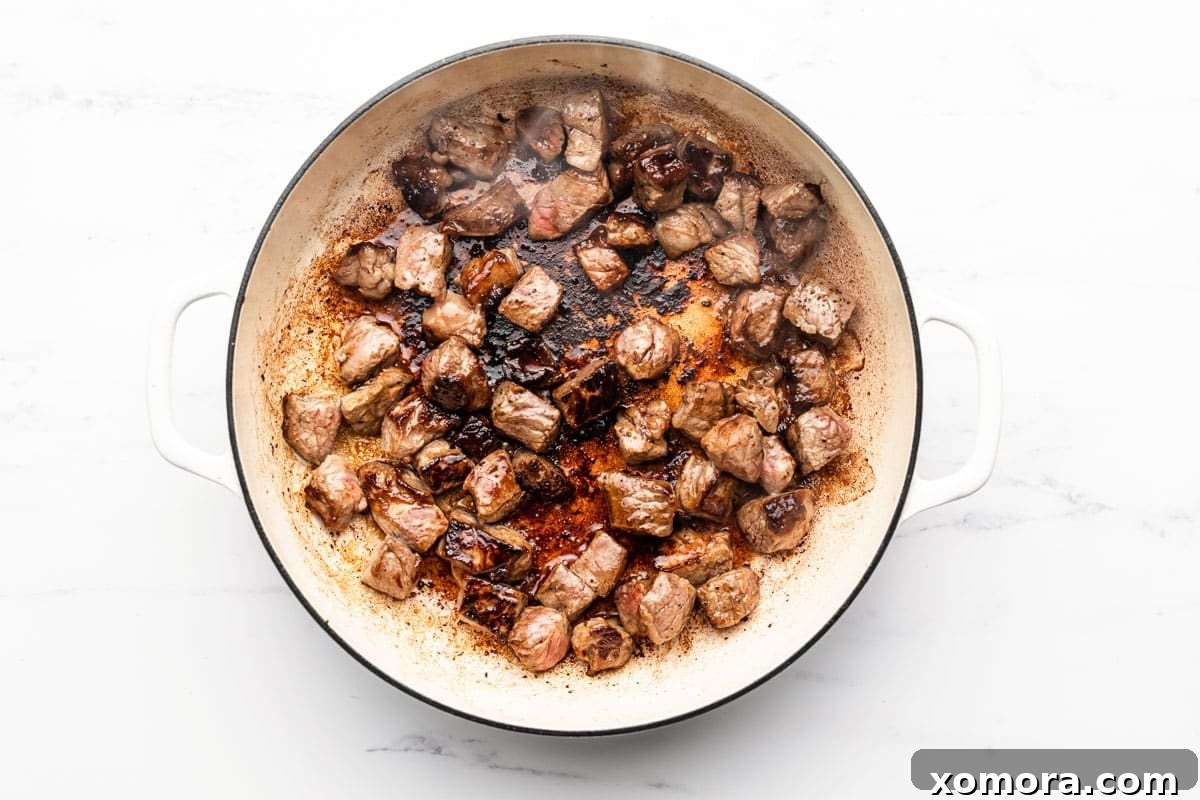 Tender Skillet Steak Bites in Rich Mushroom Gravy 3 A second image of the Skillet Steak Bites in Mushroom Gravy, showcasing the rich, dark gravy and tender mushrooms.