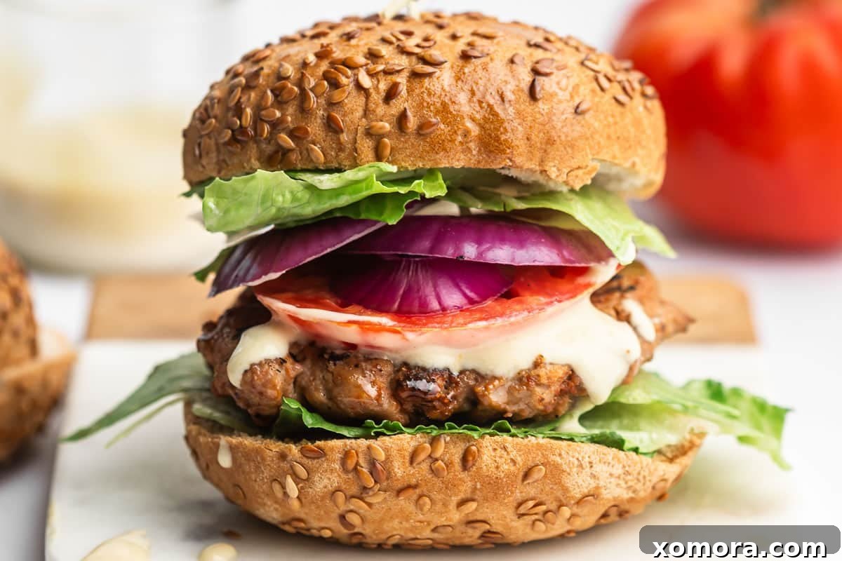 Dijon Turkey Burgers on the Grill 6 Close-up of a Dijon turkey burger patty cooked and ready to be served.