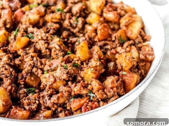 Close-up view of the savory Ground Turkey and Potato Skillet cooking in a pan