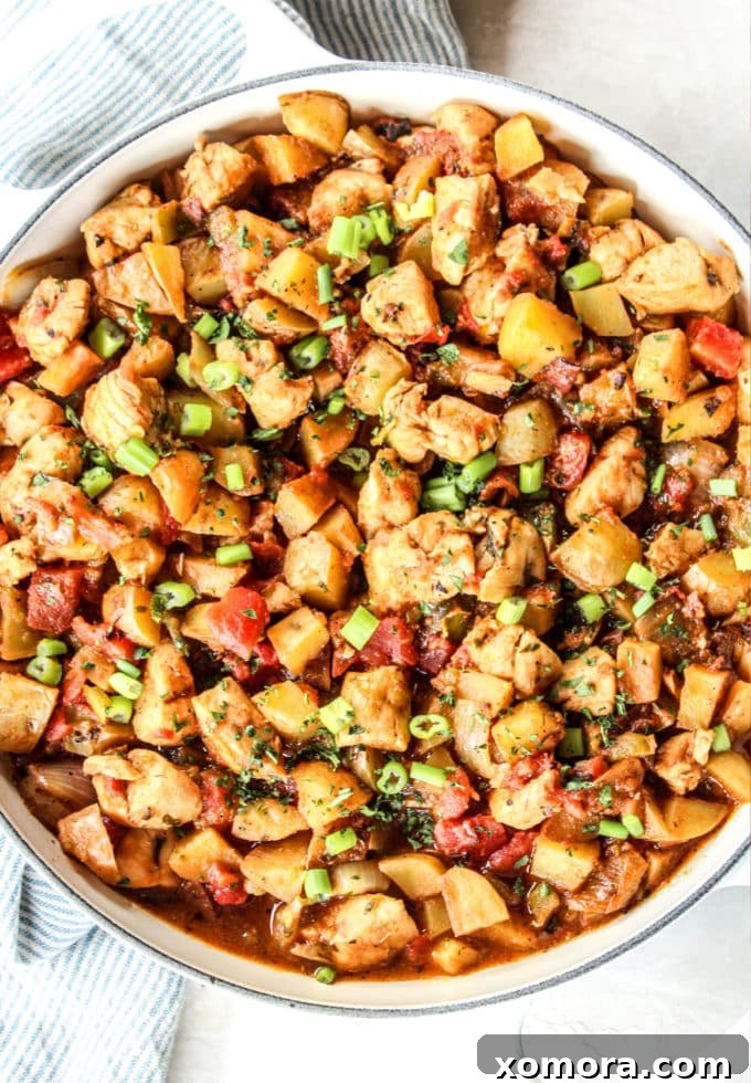 Southwestern Green Chile Chicken and Potato Skillet 4 Serving of Green Chile Chicken and Potato Skillet with toppings