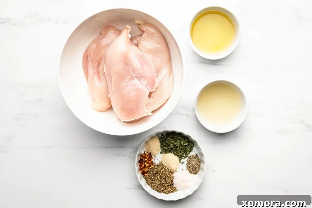Vibrant Lemon Herb Grilled Chicken 3 Chicken marinating in a clear plastic bag with lemon slices and herbs.