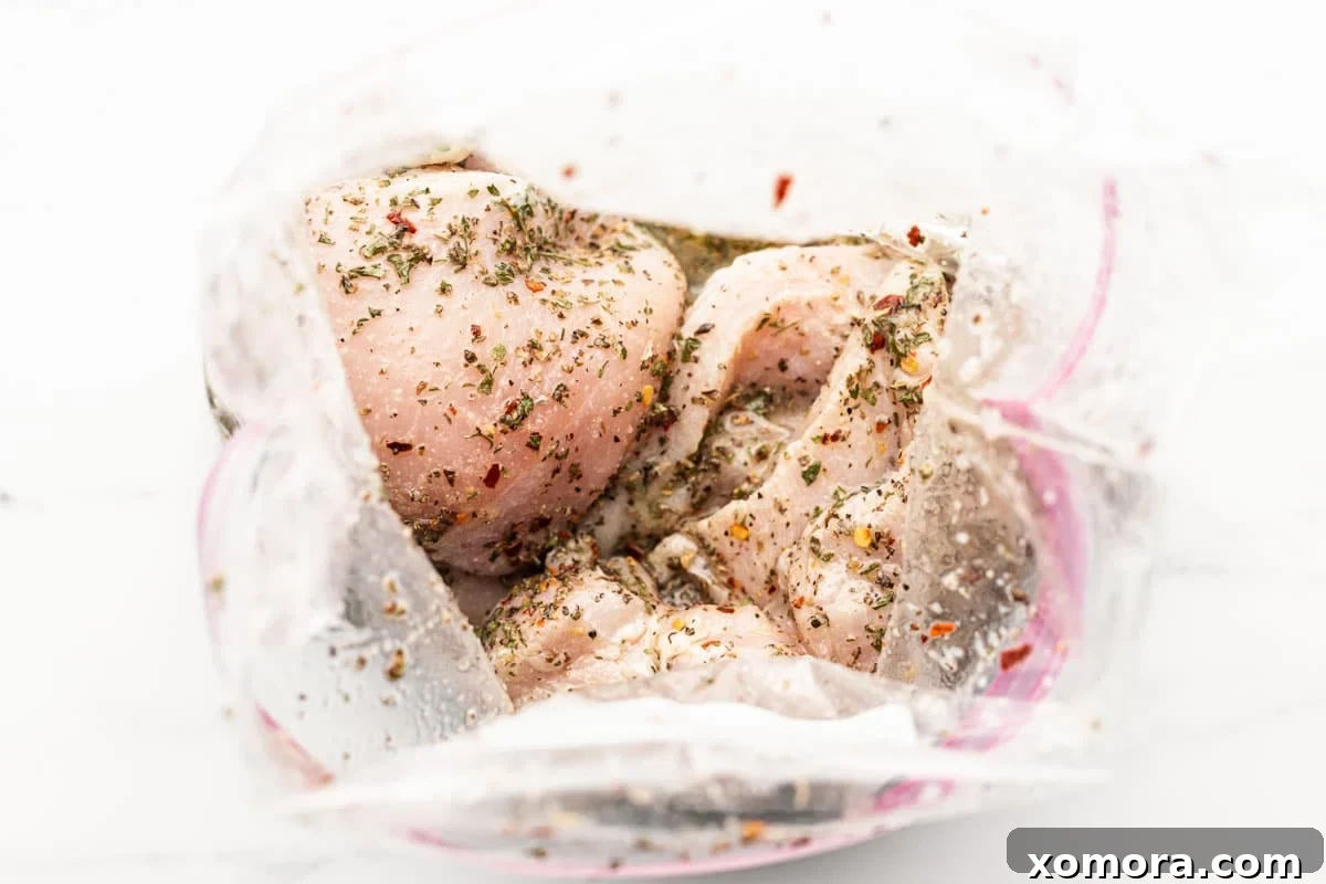 Vibrant Lemon Herb Grilled Chicken 4 Golden brown grilled chicken breast with char marks and fresh herbs.