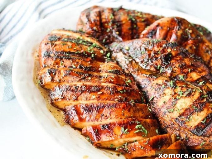 Wholesome Grilling Delights 13 Grilled chicken breasts marinated with herbs, artfully arranged on a serving plate.