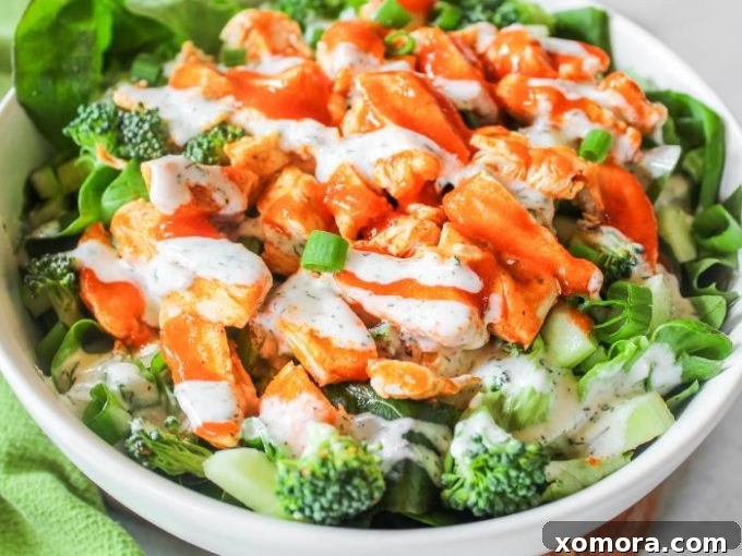 Wholesome Grilling Delights 15 A vibrant Buffalo Grilled Chicken Salad, loaded with grilled chicken, fresh vegetables, and a creamy dressing.