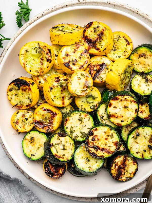 Wholesome Grilling Delights 18 Platter of perfectly grilled zucchini and squash, seasoned with herbs.