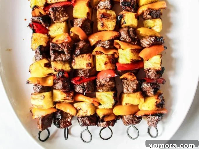 Wholesome Grilling Delights 21 Colorful Hawaiian Steak Kabobs with pineapple, bell peppers, and red onion.