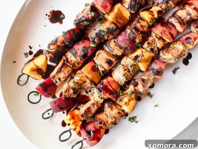 Wholesome Grilling Delights 9 Vibrant Balsamic Peach Chicken Kabobs, featuring chicken, peaches, and basil, ready for grilling.