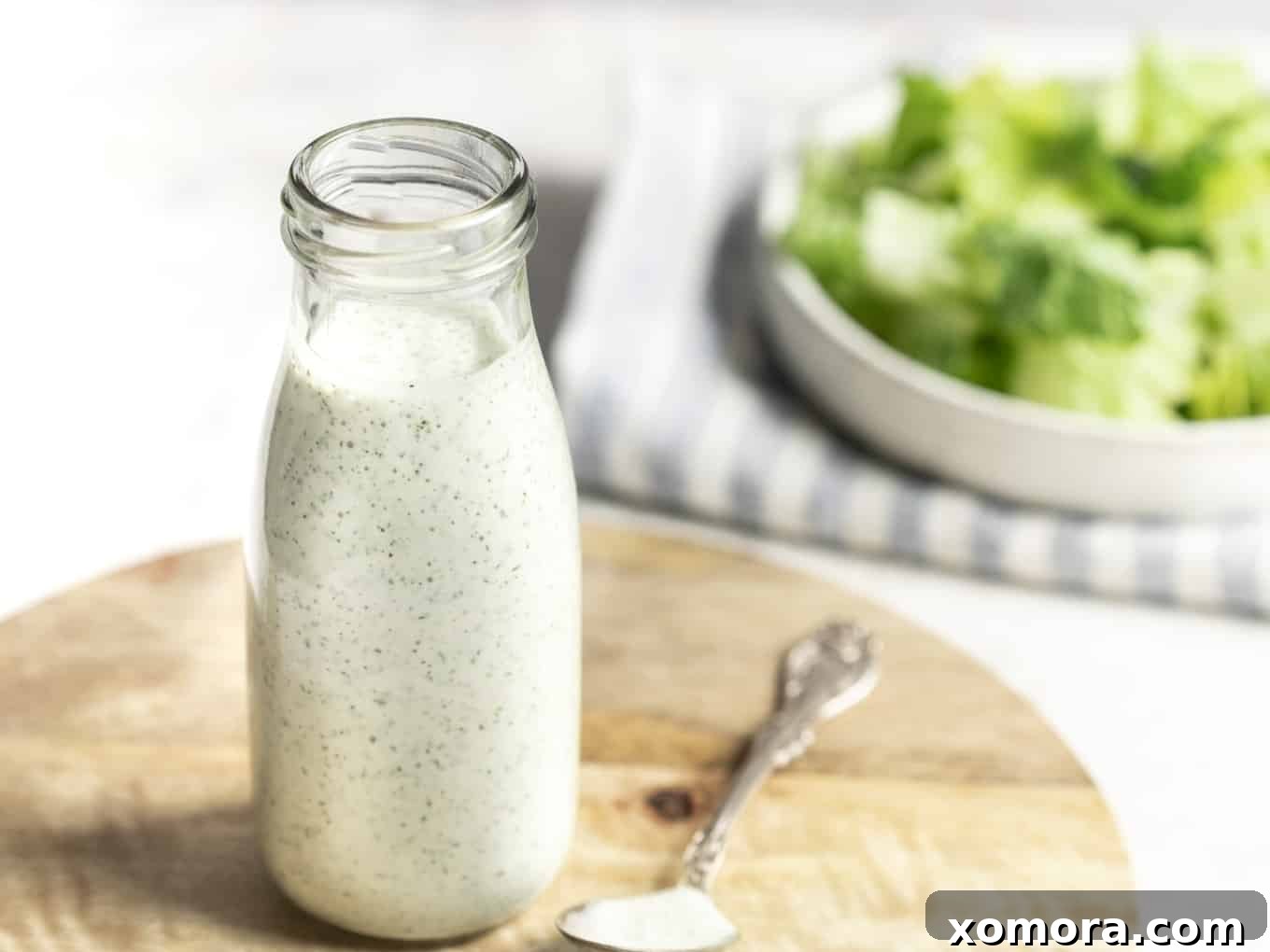 Flavorful & Guilt-Free Salad Dressings 12 Dairy Free Ranch Dressing & Dip in a glass jar, showing its creamy texture.