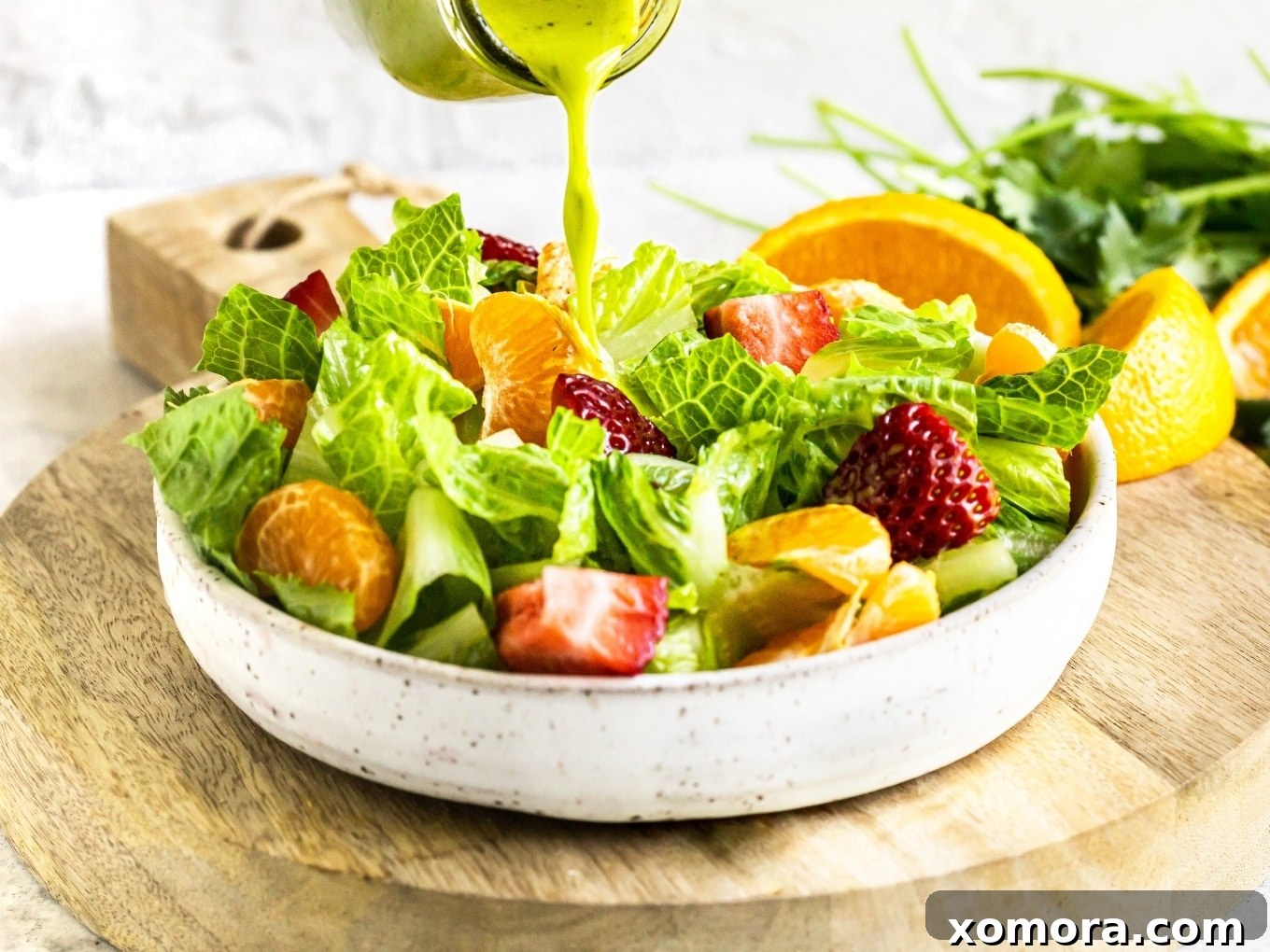 Flavorful & Guilt-Free Salad Dressings 14 Cilantro Citrus Vinaigrette in a glass jar, showing its fresh green color.