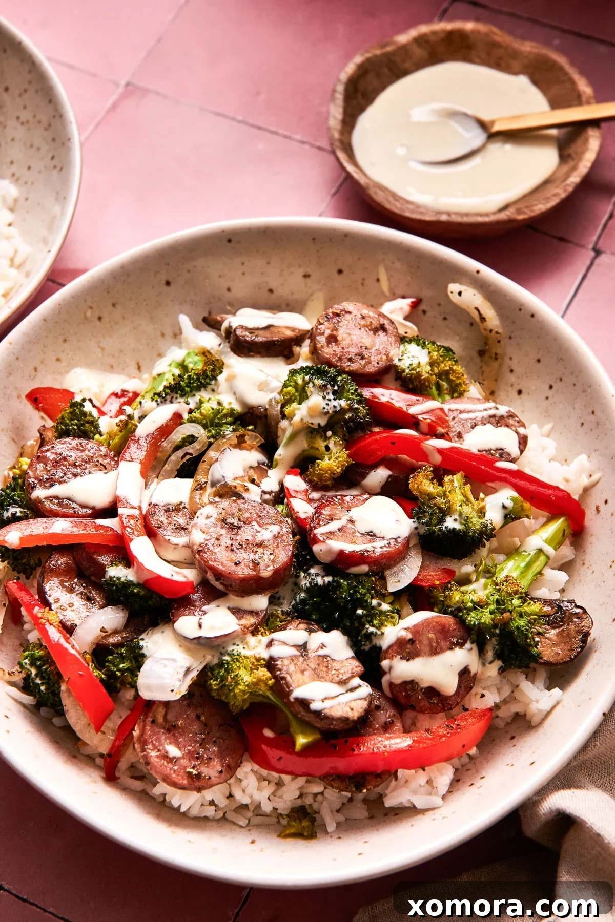 Sausage & Veggie Power Bowls with Zesty Mustard 7 Leftover roasted sausage and vegetables stored in an airtight container for meal prep.