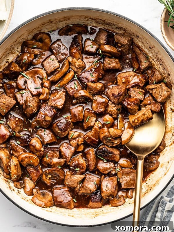Reader-Approved Healthy Dinners 12 Skillet Steak Bites in Mushroom Gravy served over mashed potatoes.