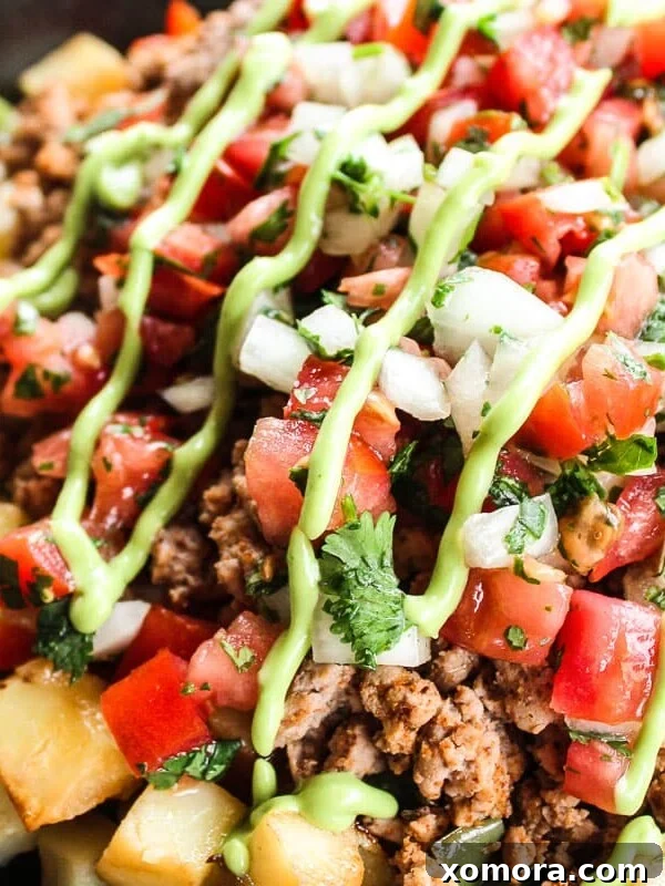 Reader-Approved Healthy Dinners 5 Turkey Taco Skillet with seasoned ground turkey and vegetables.