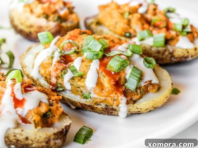 Buffalo Chicken Loaded Potatoes 4 A tray of freshly baked Buffalo Chicken Twice Baked Potatoes, perfectly golden and ready to be served.