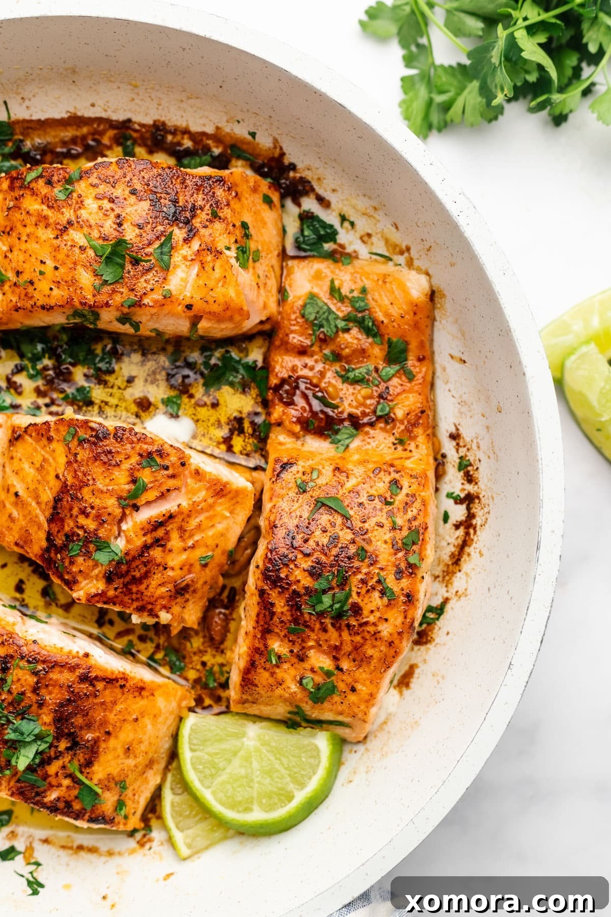 Smoky Zesty Salmon Skillet 2 Pan-Seared Chipotle Lime Salmon with golden crust and flaky inside, garnished with fresh parsley.