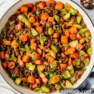 Savory Beef and Sweet Potato Hash 7 Ground Beef and Sweet Potato Skillet, garnished and ready to serve.