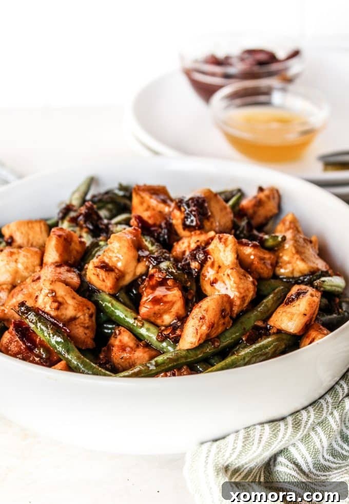 Sautéed Chipotle Chicken with Green Beans on a white plate