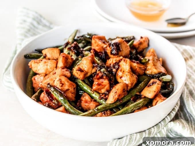 Finished Chipotle Chicken with Green Beans in a skillet, ready to serve