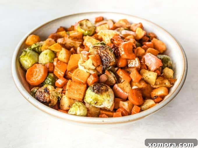 Golden Maple Glazed Roasted Vegetables 6 Maple Roasted Veggies served in a bowl, garnished with fresh herbs