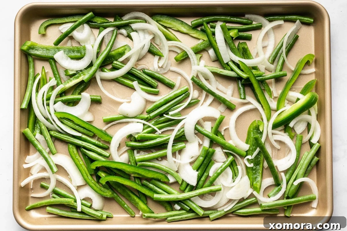 Effortless Sheet Pan Beef Tips and Roasted Veggies 4 A close-up of the sheet pan with beef tips and vegetables after being broiled, showcasing caramelized edges.