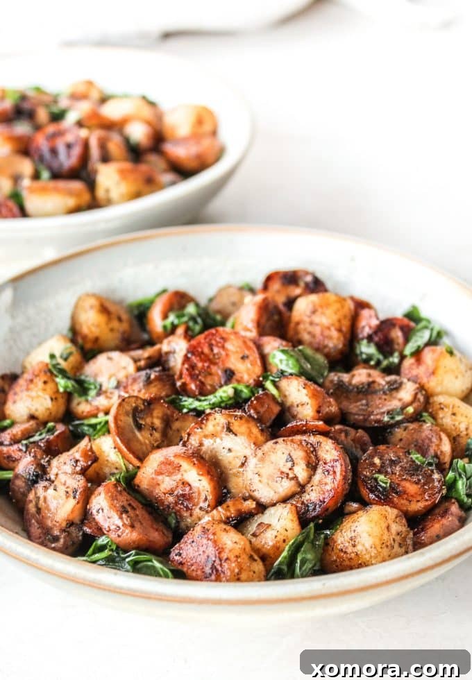 Comforting Sausage and Mushroom Cauliflower Gnocchi 2 Sausage & Mushroom Cauliflower Gnocchi in a skillet