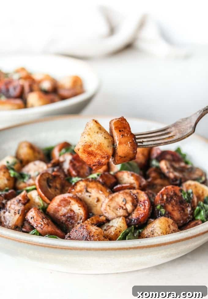 Comforting Sausage and Mushroom Cauliflower Gnocchi 5 Cooking Sausage & Mushroom Cauliflower Gnocchi in a skillet