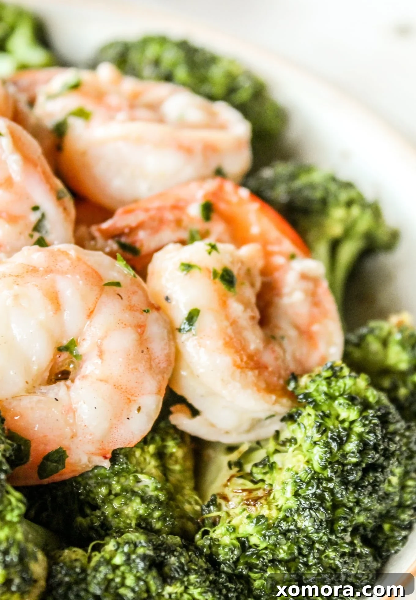 Zesty Lemon Butter Shrimp 2 Lemon Butter Shrimp cooked in a skillet