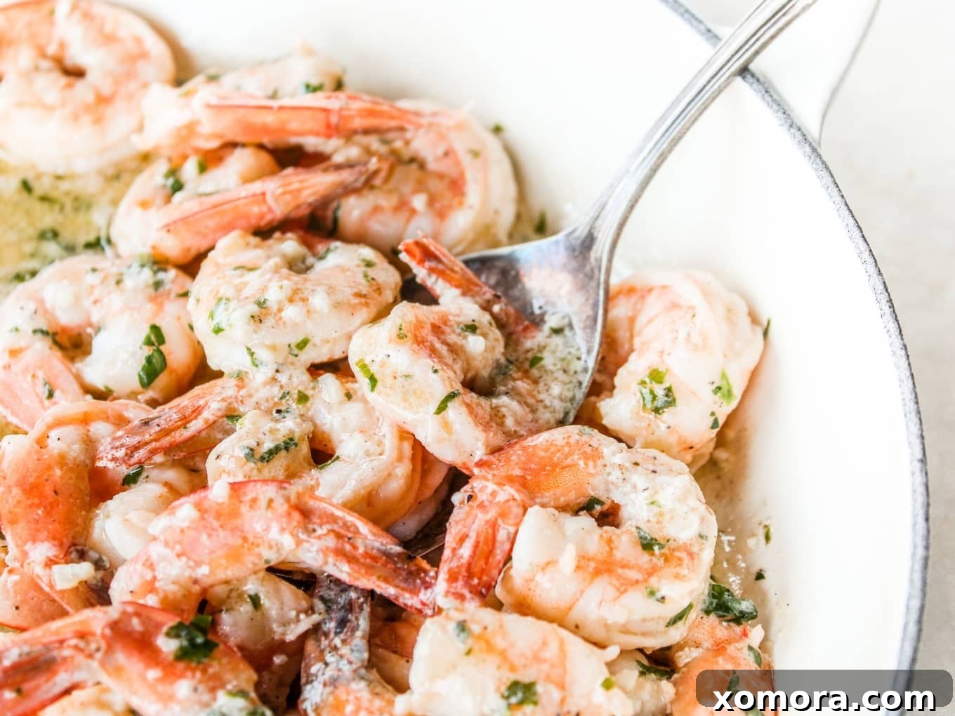 Zesty Lemon Butter Shrimp 3 Close-up of Lemon Butter Shrimp in a pan with lemon slices