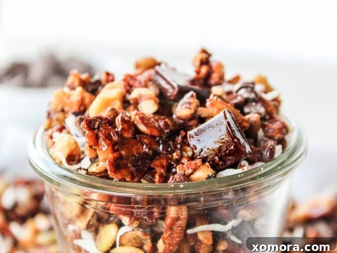 Irresistible Grain Free Chocolate Chunk Granola 4 A batch of freshly baked grain-free chocolate chunk granola spread on a baking sheet, cooling down and ready for the chocolate.