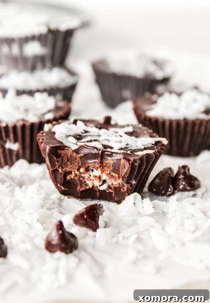 Dark Chocolate Coconut Bliss Bites 2 Delicious 3-Ingredient Dark Chocolate Coconut Cups arranged on a serving plate, ready to be eaten