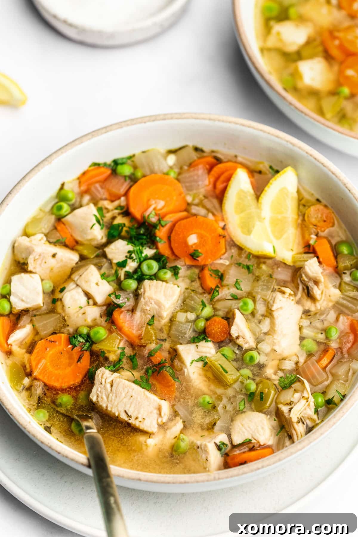 Wholesome Keto Chicken Cauliflower Soup 5 A large pot of Chicken and Cauliflower Rice Soup simmering on the stove.