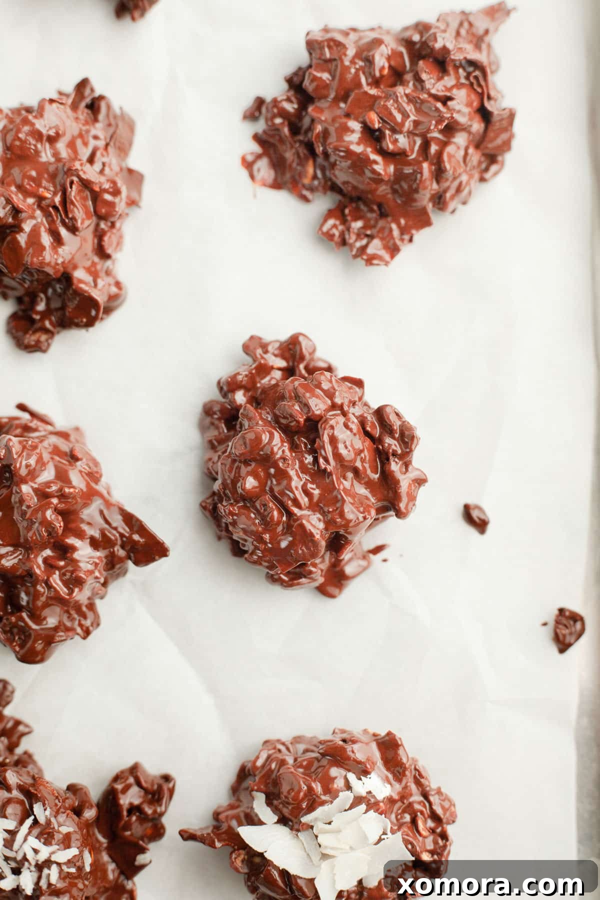 A baking sheet filled with scoops of the chocolate-oat mixture, ready for chilling.