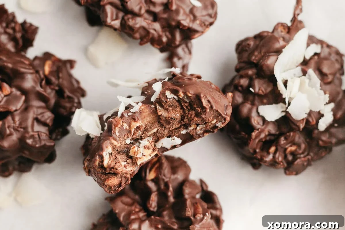 Close-up of a finished No Bake Chocolate Coconut Cookie on parchment paper.