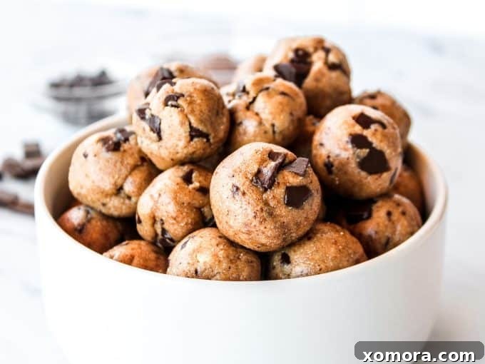 Wholesome Grain-Free Cookie Dough Delights 5 Several grain-free cookie dough bites arranged on a small white plate, showcasing their inviting appearance.