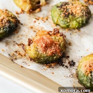 Crispy Parmesan Smashed Brussels Sprouts 7 Smashed Parmesan Brussels Sprouts in a serving bowl.