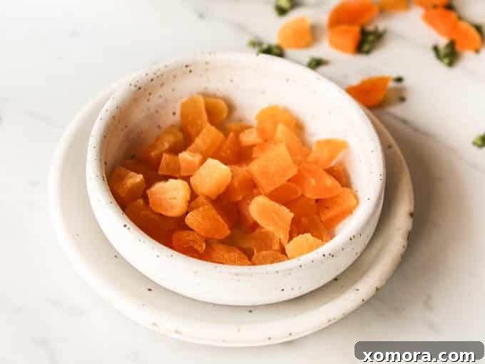 Instant Pot Apricot Glazed Chicken 4 Four individual servings of Instant Pot Apricot Chicken over rice, ready to eat.