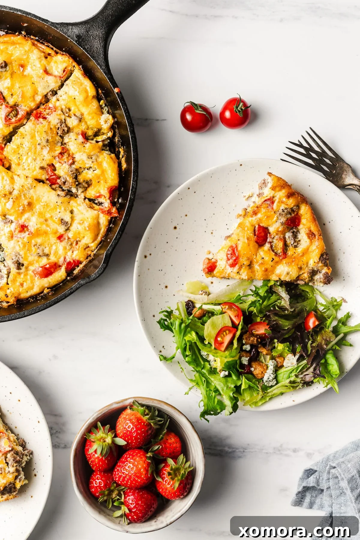 Cheeseburger Egg Bake 6 A slice of Cheeseburger Frittata served on a plate with a fork, ready to be enjoyed