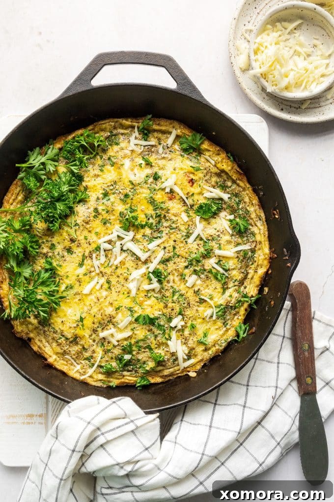 Golden Parmesan Herb Frittata 3 Close-up of the Parmesan Herb Frittata baking in a cast iron skillet.