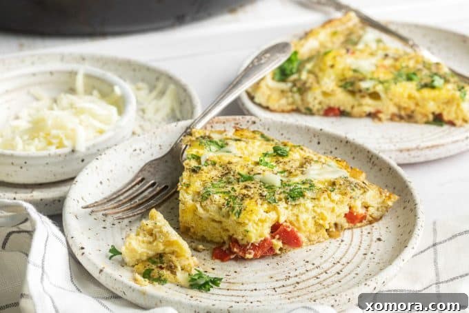 Golden Parmesan Herb Frittata 4 A freshly baked Parmesan Herb Frittata in a cast iron skillet, garnished with fresh parsley.