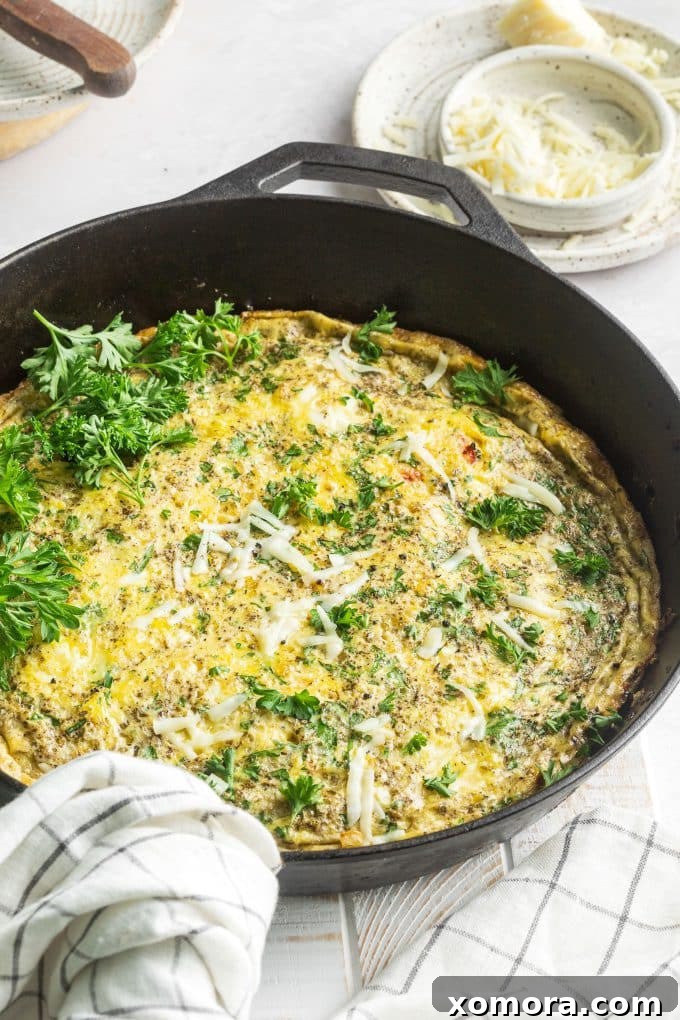 Golden Parmesan Herb Frittata 5 A beautifully set Parmesan Herb Frittata sliced and ready to serve.
