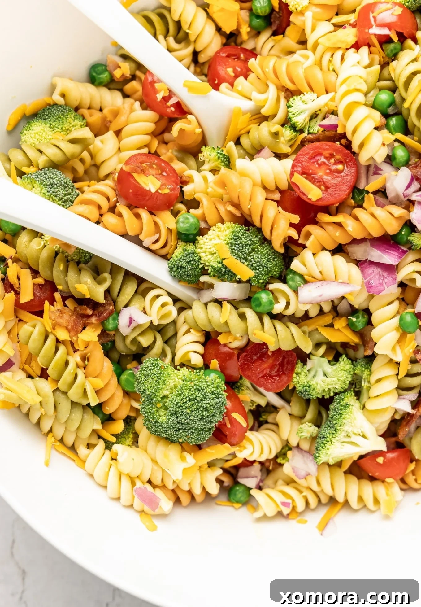 Ultimate Creamy Bacon Ranch Pasta 3 Close up of Creamy Bacon Ranch Pasta Salad with a serving spoon.