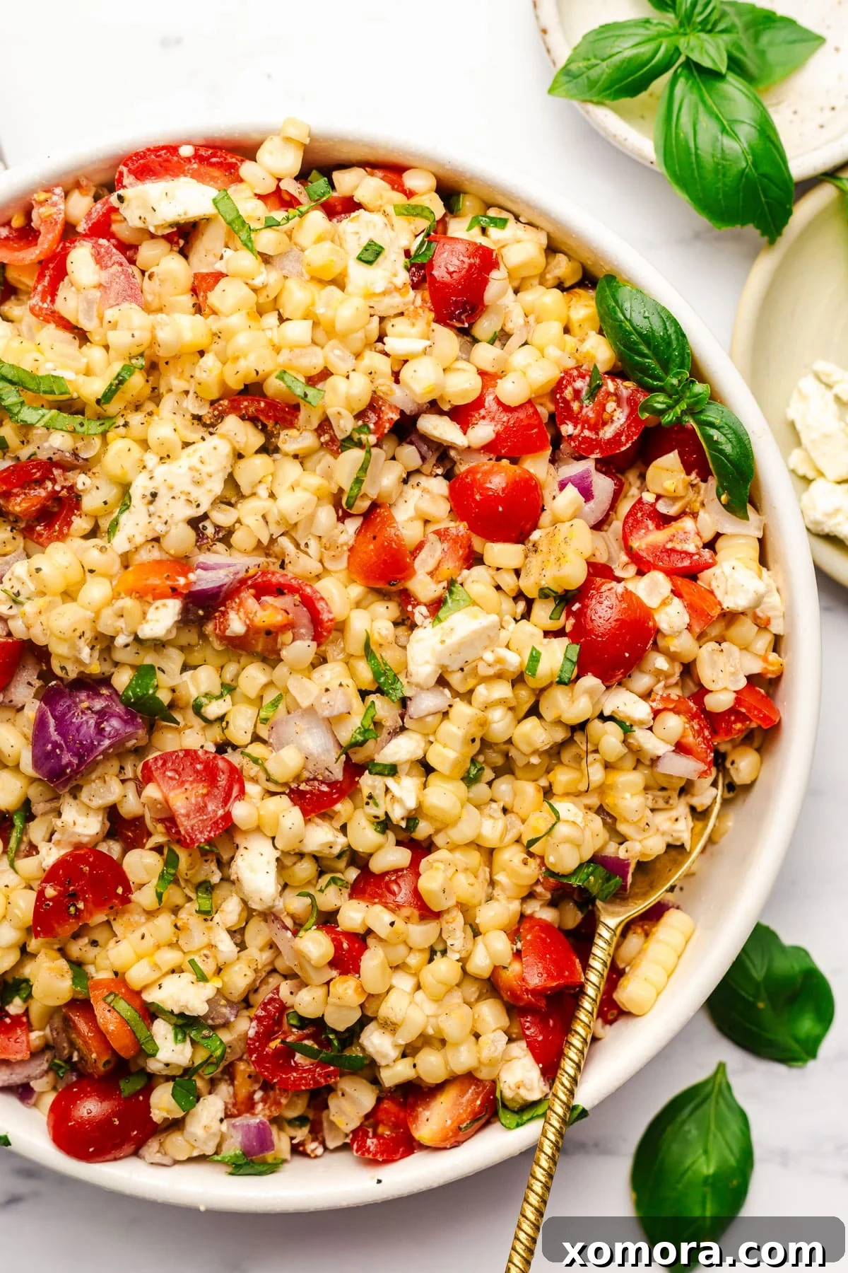 Zesty Charred Corn Salad 2 Vibrant grilled corn salad in a rustic bowl, garnished with fresh basil.