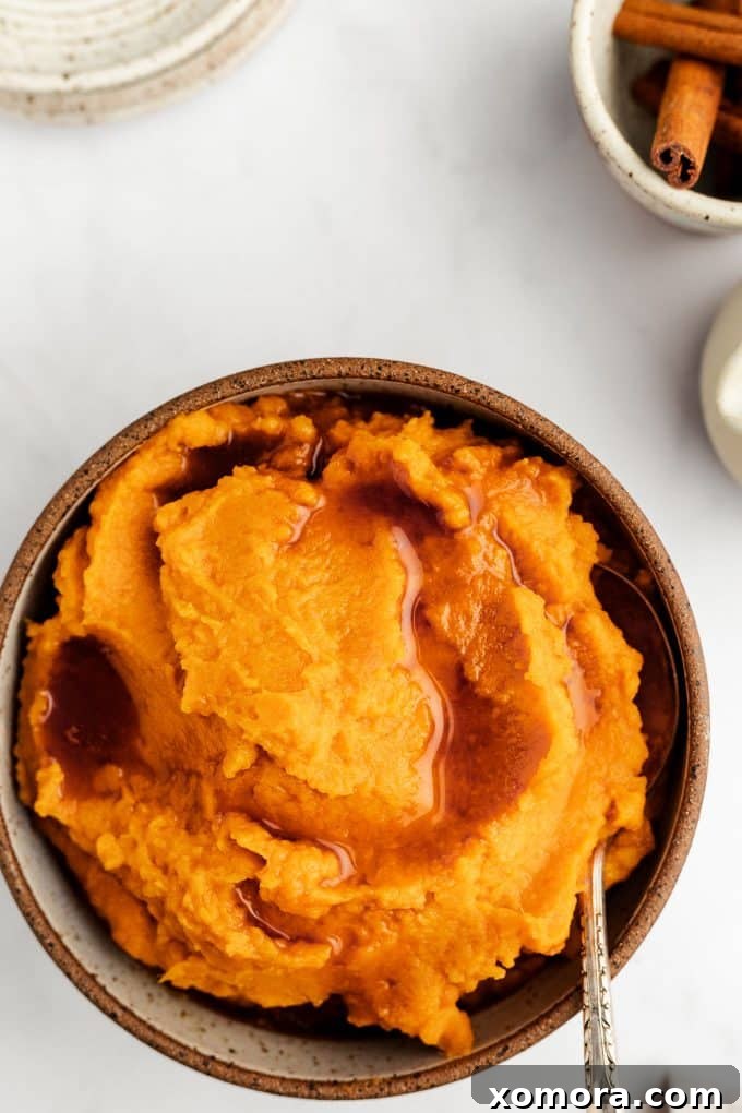 Creamy Maple Sweet Potatoes 3 Close-up of a bowl of Maple Mashed Sweet Potatoes, showcasing its smooth and creamy texture.