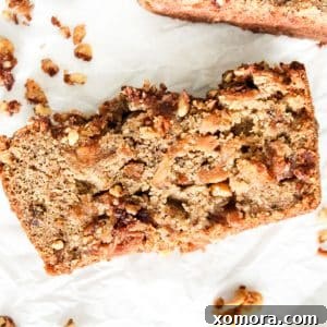 A freshly baked loaf of Gluten-Free Apple Bread with Walnut Crumble, ready to be sliced