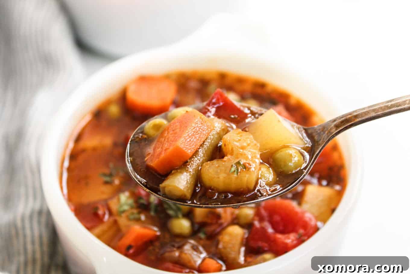 Effortless 30-Minute Vegetable Soup 3 A close-up shot of the vegetable soup simmering in a pot, showcasing the colorful array of fresh vegetables.