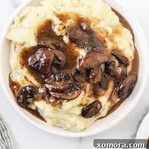 Close-up of freshly prepared mushroom gravy in a rustic bowl, ready to be served.